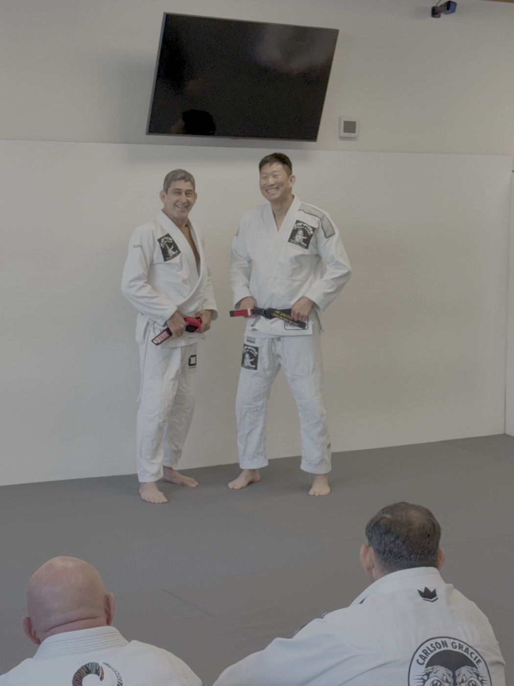 Brian being promoted on the mats at a Brazilian Jiu-Jitsu academy