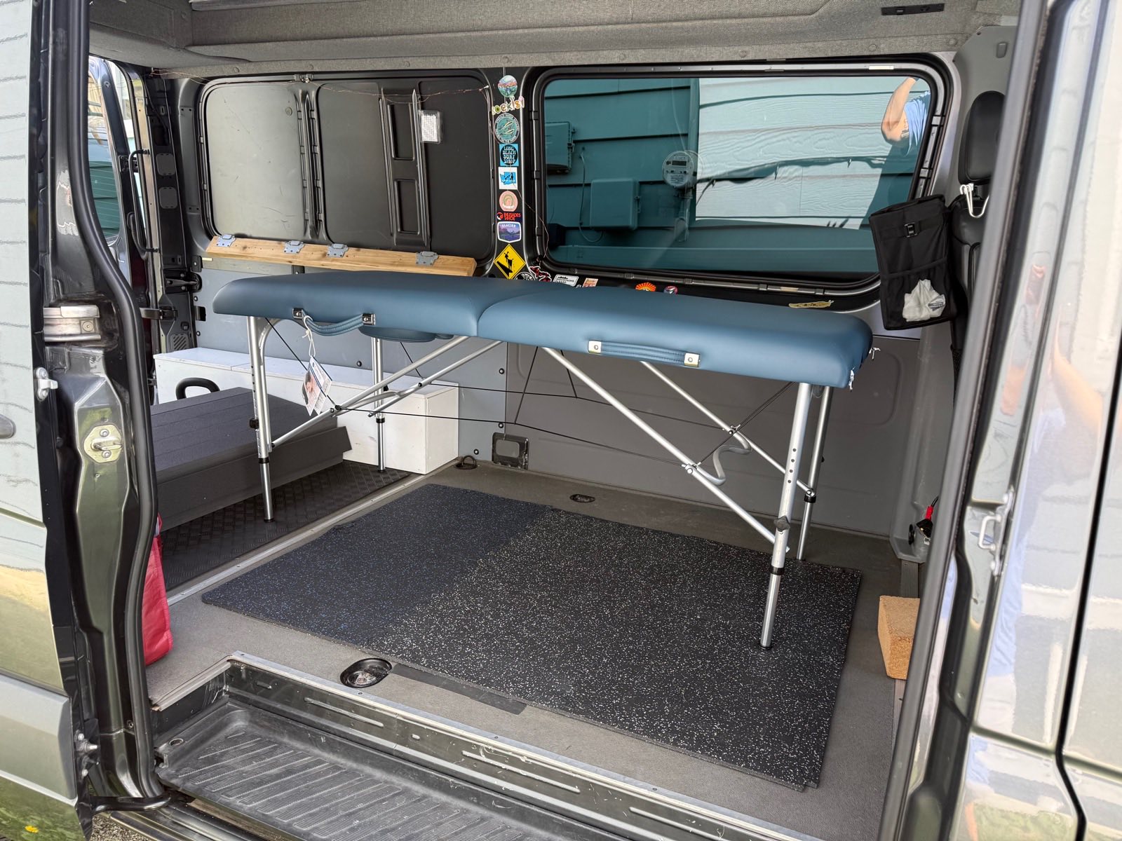 Inside the Roll Ready PT pop-up treatment van, set up with a treatment table